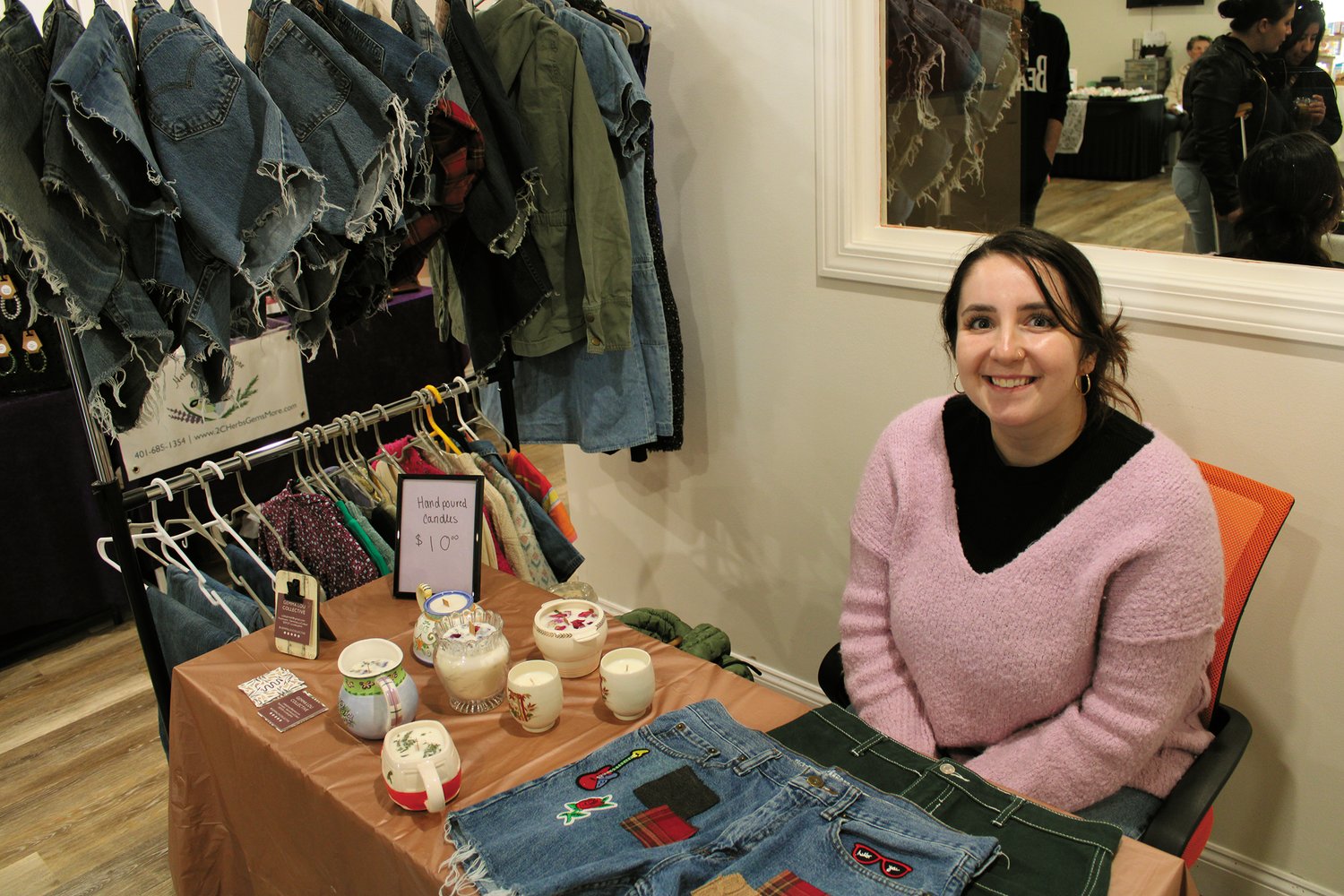 SMILING WITH SUSTAINABLE PRIDE: Caleigh Eleftherion, of the Gemma Lou Collective, shows off her sustainable fashion and candles made with love.